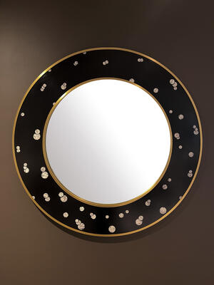 The Jules Mirror in Bubbles incorporates eggshells and resin in a pattern inspired Jules Dunand. 